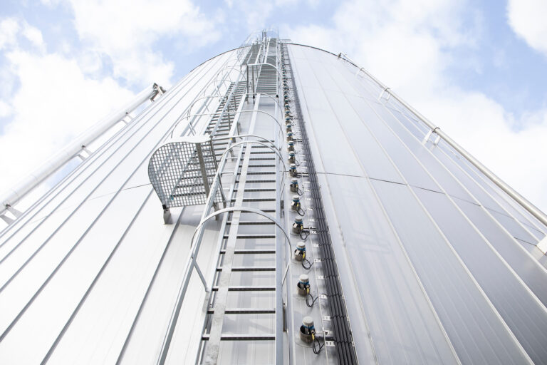 Ladder and safety platform on a hot water buffer tank at the Royal Swinkels brewery