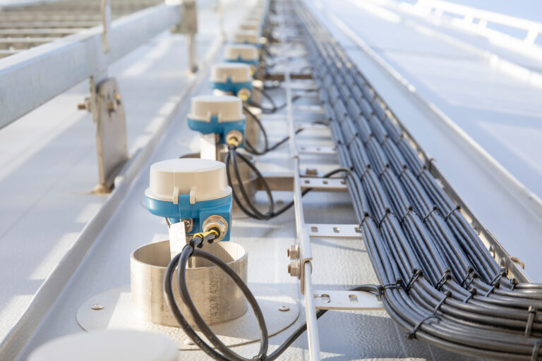 Sensors and cabling installed on a hot water buffer tank at the Royal Swinkels brewery.